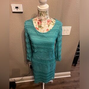 Cute lightweight lace turquoise dress. Never worn with tags.